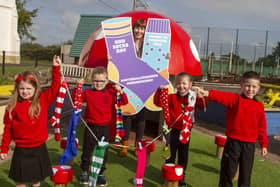 Deirdre McAliskey, Assistant Director at the National Children's Bureau with (l-r) Emily-Rose, Caolan, Evie and Cathaoir, Primary 2 students at St John's Primary School, Kingsisland, Co Tyrone