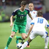 Northern Ireland's Paddy McNair with

Slovakia's Dusan Svento  in a match between the countries in 2016. They play again at football today. But how do the economies of the two match up? Pic William Cherry Presseye