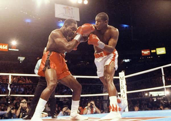 13 Nov 1992: Riddick Bowe and Evander Holyfield trade blows during a bout in Las Vegas, Nevada. (Picture: Getty Images).