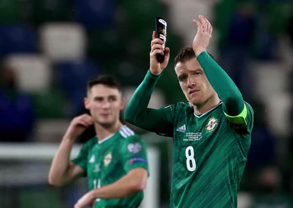 Northern Ireland captain Steven Davis applauds the fans after Thursday’s defeat. Pic by PA.