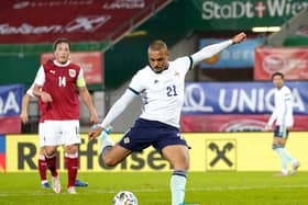 Northern Ireland’s Josh Magennis fires home the opening goal in Austria. Pic by PA.