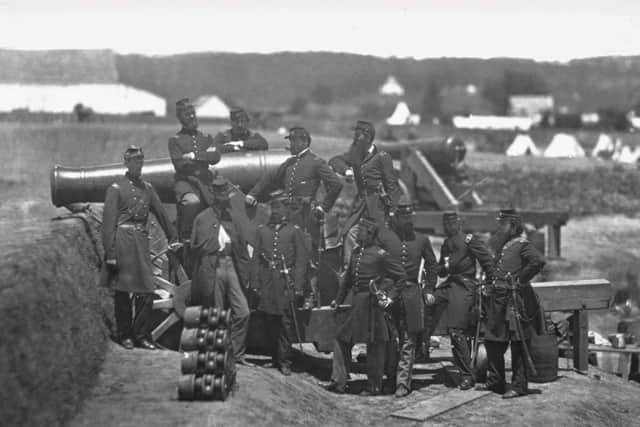 Union soldiers pose for a photograph with a cannon during the American Civil War. one of the earliest true industrial wars. Railroads, the telegraph, steamships, and mass-produced weapons were employed extensively