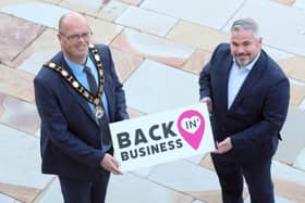 Mayor of Antrim and Newtownabbey, Councillor Jim Montgomery is joined by Gerry McKibbin, Department for Communities who have part funded the financial assistance for businesses located outside town centres