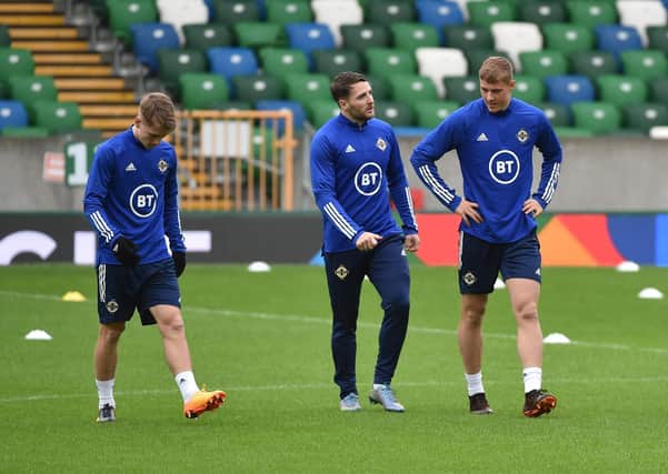 Northern Ireland's Ethan Galbraith , Conor Washington and Daniel Ballard during  a training session at The National football stadium at Windsor Park on Tuesday.
