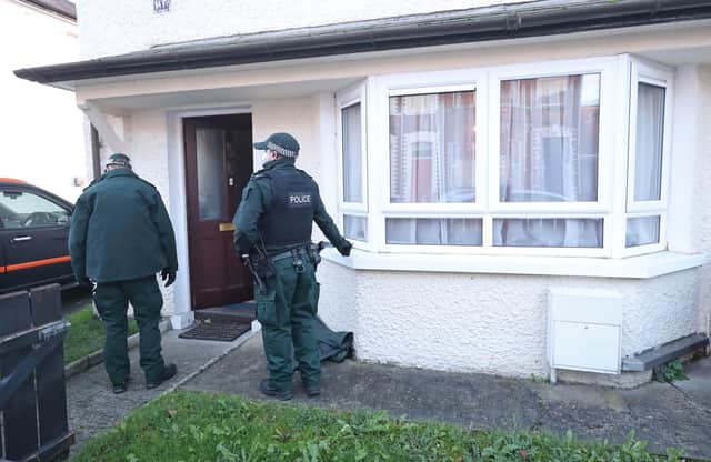 Police search a property in south Belfast