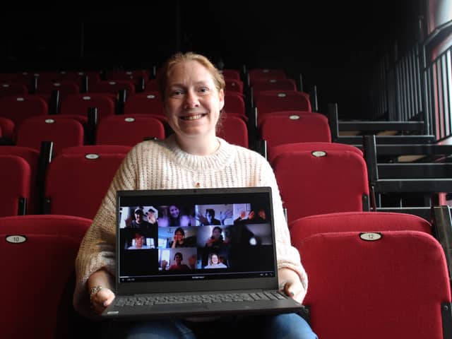 Fiona from the Playhouse with a screenshot of the young people taking part