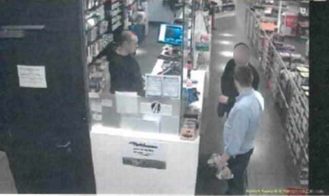 Screengrab taken from CCTV dated 08/10/19 issued by Essex Police of Eamonn Harrison (in blue shirt) with Petrisor Zgarcea, who he knew as Alex, in a shop in Belgium