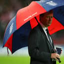 Steve McClaren manager of England looks on from under his umbrella prior to the Euro 2008 Group E qualifying match between England and Croatia at Wembley Stadium on November 21, 2007.  (Photo by Alex Livesey/Getty Images).