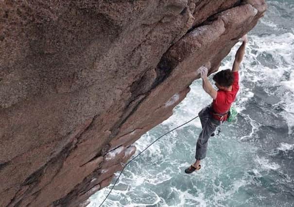 Ricky Bell climbing a perfect grantite arete above the Atlantic at Owey Island, Donegal. Picture: Pat Nolan.