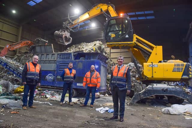Environment Minister Edwin Poots pictured with Trevor Clarke MLA, Martin McKinstry and Darren McKinstry during a visit to McKinstry Skip Hire Limited in Crumlin