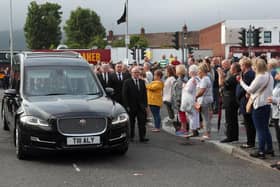 PACEMAKER, BELFAST, 26/6/2020: A guard of honour flanks the hearse carrying the body of leading republican Bobby Storey to his Anderonstown home in Belfast. PICTURE BY STEPHEN DAVISON