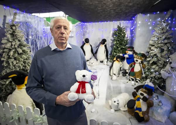 Robin Mercer of Hillmount Garden Centre in Belfast holding the Hillmount Christmas Bear called Ava, in the Santa's Grotto.