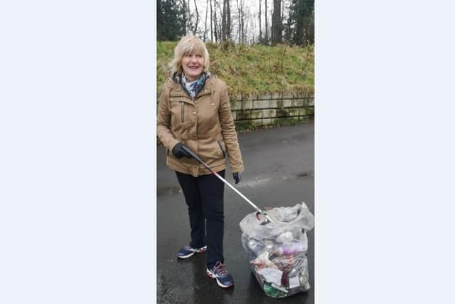 Community Champion Healther lifts 100 bags of rubbish.