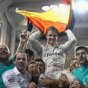 Nico Rosberg of Germany and Mercedes GP celebrates with his team after finishing second and securing the F1 World Drivers Championship during the Abu Dhabi Formula One Grand Prix at Yas Marina Circuit on November 27, 2016 .  (Photo by Clive Mason/Getty Images).