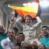 Nico Rosberg of Germany and Mercedes GP celebrates with his team after finishing second and securing the F1 World Drivers Championship during the Abu Dhabi Formula One Grand Prix at Yas Marina Circuit on November 27, 2016 .  (Photo by Clive Mason/Getty Images).