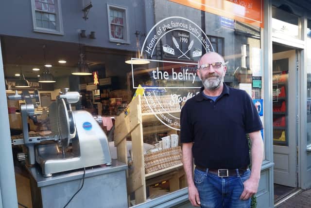 Thirty years later: Outside the Belfry Deli is owner Paul McCafferty