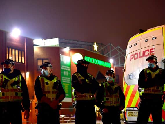 Police are seen outside Celtic Park following the Betfred Cup match between Celtic and Ross County