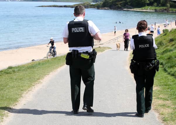 PSNI officers patrolling Helen's Bay in the early stages of the Covid pandemic restrictions in May this year. Photo: Declan Roughan
/Presseye