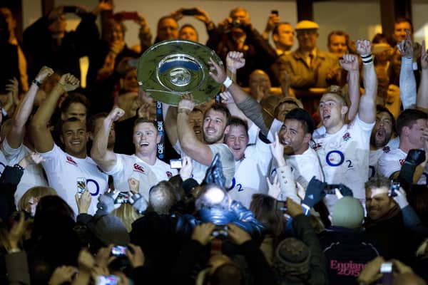 England's Captain Chris Robshaw (C) lifts the Hillary Shield after defeating New Zealand in the international rugby union match at Twickenham Stadium, southwest of London, on December 1, 2012. England won the game 38-21 ending New Zealand's 20-game unbeaten run. Photo: ADRIAN DENNIS/AFP via Getty Images).