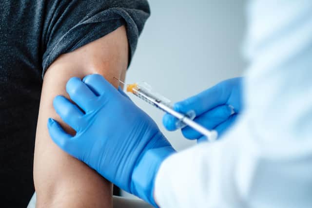 Undated handout photo issued by BioNTech SE 2020 of a patient being given a dose of a coronavirus vaccine produced by BioNTech