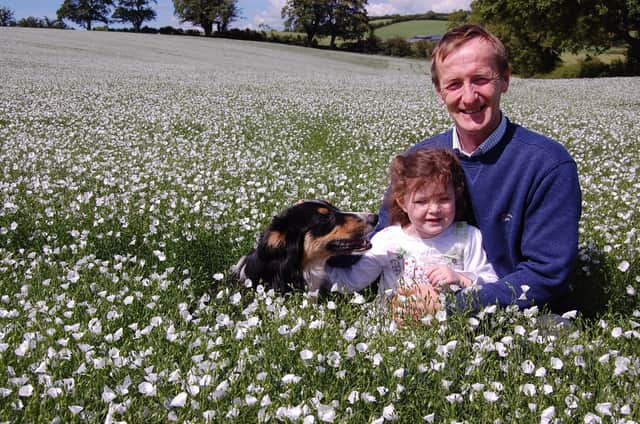 Jim Magill of Mount Mills pictured with daughter Grace is field of flax on the family farm near Newry in Co Down