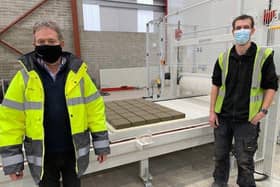 David Henderson and Trevor Smyth celebrate the first blocks produced in Tobermores new £10million factory