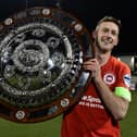 Larne captain Jeff Hughes with the Co Antrim Shield. Pic Colm Lenaghan/Pacemaker