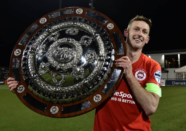 Larne captain Jeff Hughes with the Co Antrim Shield. Pic Colm Lenaghan/Pacemaker