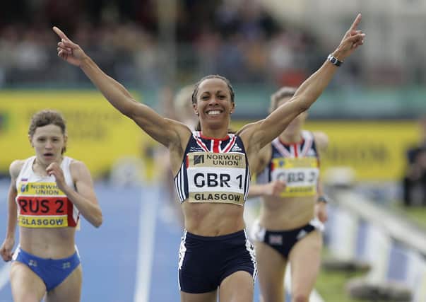 Kelly Holmes of Great Britain celebrates winning the womens 1500m during the Norwich Union international between Great Britain, Russia and USA on June 5, 2005 in Glasgow. (Photo by Gary M.Prior/Getty Images).