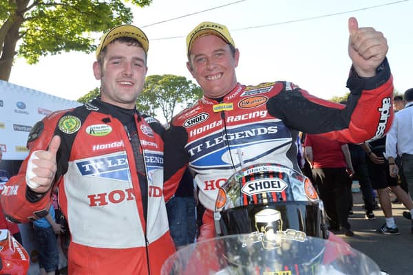 Honda Legends team-mates Michael Dunlop and John McGuinness at the Isle of Man TT in 2013.