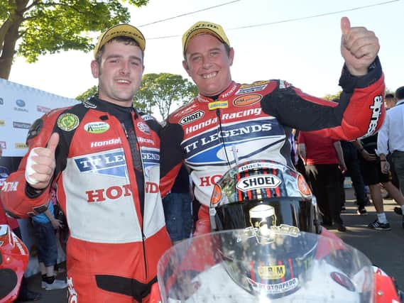 Honda Legends team-mates Michael Dunlop and John McGuinness at the Isle of Man TT in 2013.