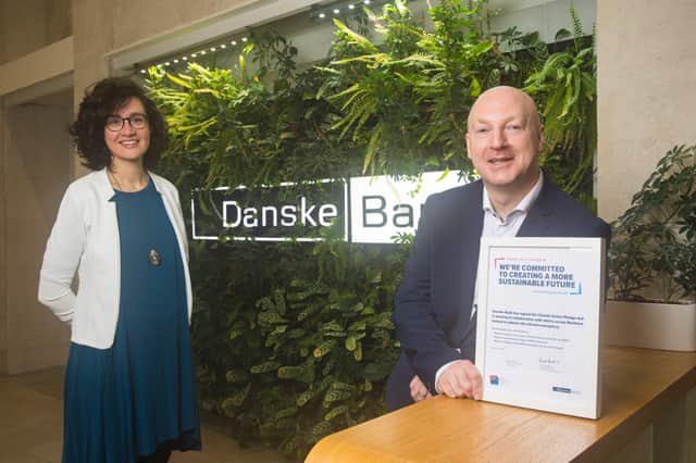 Pictured with the Climate Action Pledge are Geraldine Noé, Head of Environment at Business in the Community and Chris Martin, Head of Climate Risk and Strategy at Danske Bank