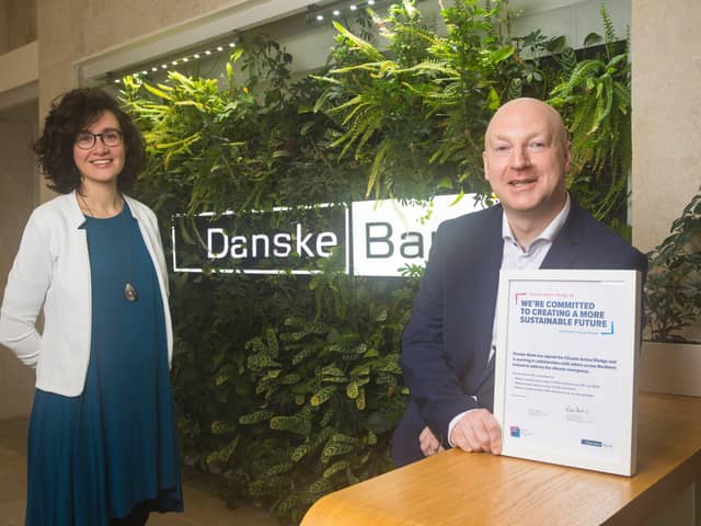 Pictured with the Climate Action Pledge are Geraldine Noé, Head of Environment at Business in the Community and Chris Martin, Head of Climate Risk and Strategy at Danske Bank