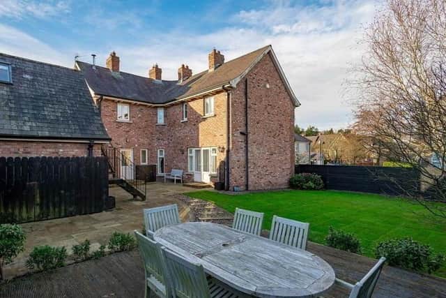 The property has landscaped gardens in lawns with sleeper and pebbled path to raised deck sitting area and paved barbeque area