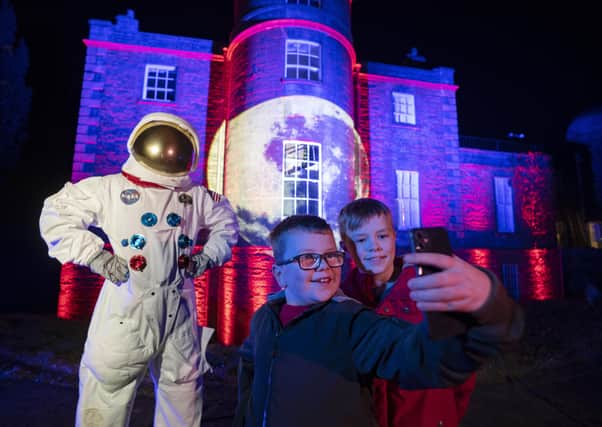 Jack, 9 and Tyler, 11 take in the lights with a friendly astronaut at Armagh Observatory and Planetarium