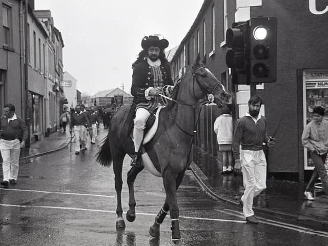 Not even a red light could stop Trevor Whitten's Earl of Alexander as he led the Apprentice Boys' parade through Comber in December 1988. The News Letter noted that members of the Apprentice Boys of Derry had been urged to show the same resolve as the original apprentices who had closed the city gates. The plea came on the day that the organisation began it's celebrations marking the 300th anniversary of the Siege of Derry. Co Down members converged in Comber for an historic re-enactment. A letter – a replica of one sent on the same day in 1688 – had left the town in the safekeeping of two marathon runners for Londonderry. The letter warned of a plot by the nationalist Redshanks to rise up on December 9, 1688, and murder Protestants. Picture: Eddie Harvey/News Letter archives