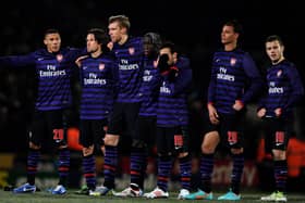 A dejected Arsenal team look on as they head out of the competition in the penalty shootout during the Capital One Cup quarter final match against Bradford City at Valley Parade on December 11, 2012.  (Photo by Laurence Griffiths/Getty Images).
