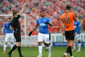 Rangers' Alfredo Morelos booked by match referee Steven McLean during the Scottish Premiership match at Tannadice Park. Pic by PA.