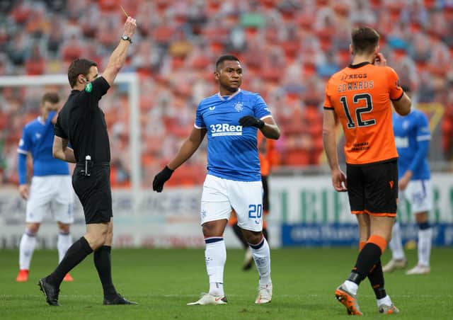 Rangers' Alfredo Morelos booked by match referee Steven McLean during the Scottish Premiership match at Tannadice Park. Pic by PA.