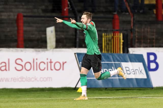 Glentoran’s Robbie McDaid celebrates his hat-trick goal against Carrick Rangers