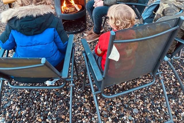 Huddling around the fire on a cold December day