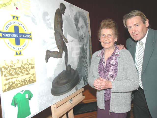 Ruby Peacock and son Russell view an image of Bertie’s statue in Coleraine