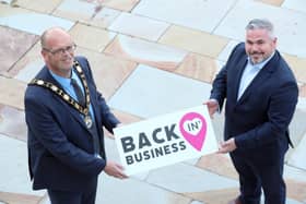Mayor of Antrim and Newtownabbey, Councillor Jim Montgomery is joined by Gerry McKibbin, Department for Communities to promote almost £1 million funding for businesses across the retail and tourism sectors of the Borough