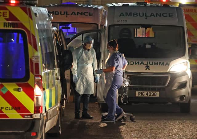 Medical staff attending to two patients in an ambulance, at Antrim Area Hospital, Co Antrim in Northern Ireland. PA Photo. Picture date: Tuesday December 15, 2020. Photo: Liam McBurney/PA Wire