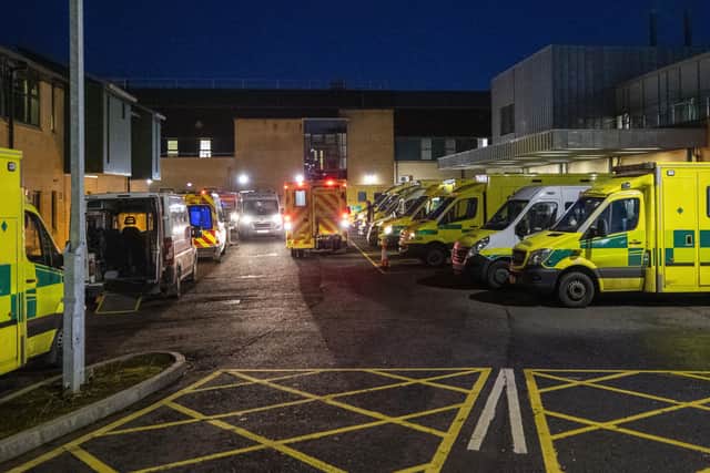 Ambulances at the entrance to the emergency department with a number of the vehicle with patients awaiting to be admitted, at Antrim Area Hospita