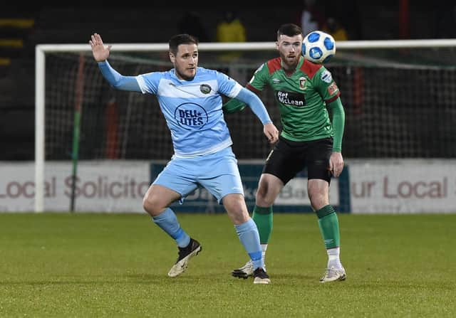 Glentoran's Patrick McClean and Warrenpoint Town's Alan O'Sullivan. Pic Colm Lenaghan/Pacemaker