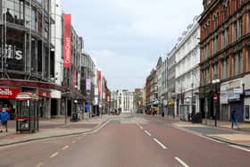 Belfast City Centre was virtually empty when this photo was taken in March due to Covid, but some believe vaccine passports could help restore normality. Photo Pacemaker Press