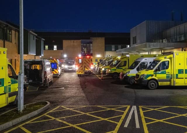 Ambulances at the entrance to the emergency department with a number of the vehicle with patients awaiting to be admitted, at Antrim Area Hospital, Co Antrim in Northern Ireland, as the emergency department and hospital is currently at full capacity. PA Photo. Picture date: Tuesday December 15, 2020. Photo credit should read: Liam McBurney/PA Wire