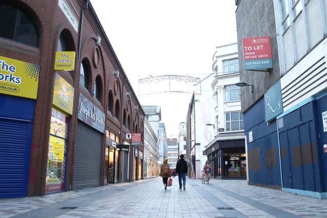 Belfast city centre earlier this month before shops reopened. Closing businesses did not cut infection rates as much as hoped, yet Stormont is going for the same tactic