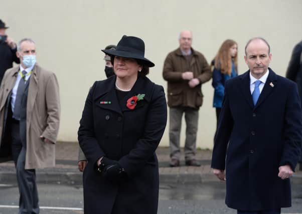 The Taoiseach Micheál Martin, right, in Enniskillen on Remembrance Sunday last month with Arlene Foster MLA, the Northern Ireland First Minister. One of Mr Martin's uncles was a British Army prisoner of wary (POW) in Japan in World War II. He is a pluralists but many unionits distrust his all island unit. Photo: Press Eye